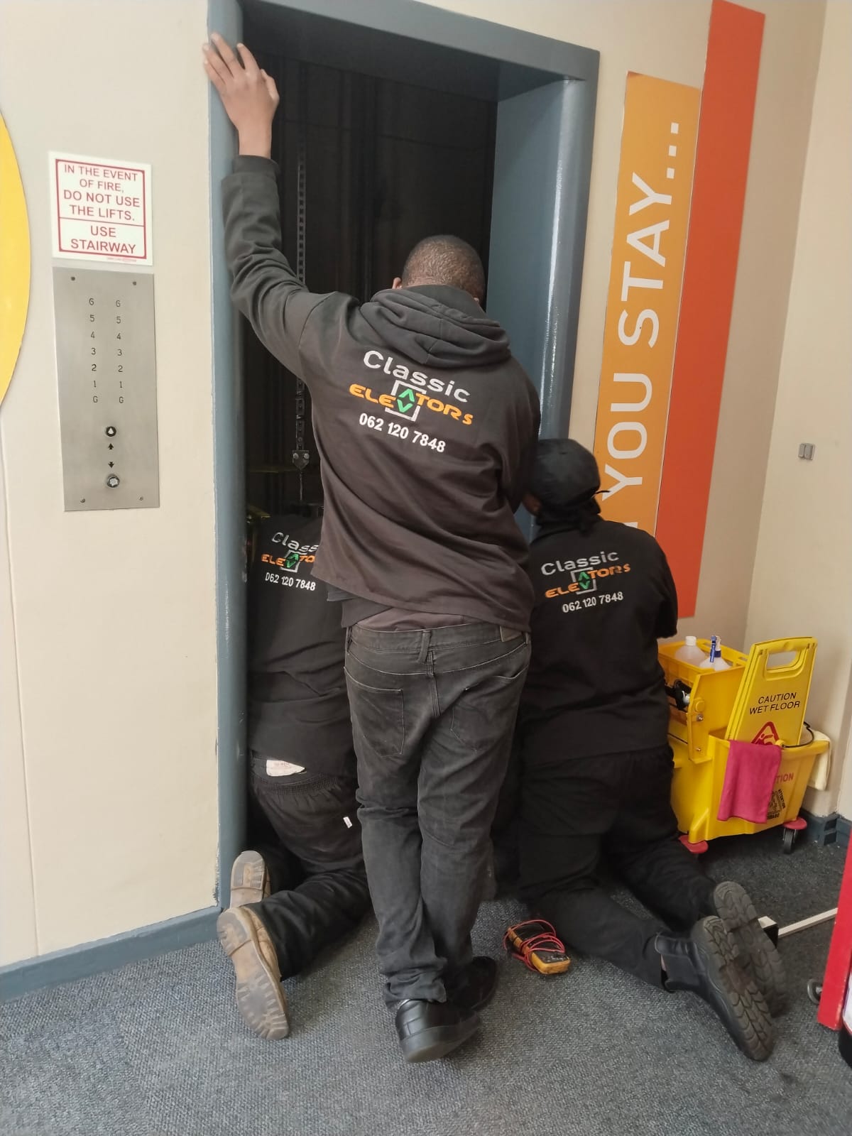 Classic Elevators technicians repairing lift equipment